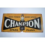 A Champion Spark Plugs enamelled steel plate advertising sign. L76.5xH35.7cm