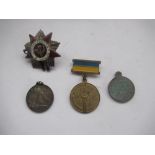 Three Russian medallions, one of Bolshevik revolution, and Russian cap badge (4)