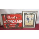 Framed Raleigh All-Steel bicycle advertisement and a vintage enamel sign "Alembic Alcophlogistin for
