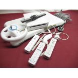 Nintendo Wii with Wi fit board. TV sensor, controllers etc