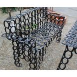 Ornate bench made entirely from horse shoes, H28cm W165cm