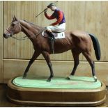 Royal Worcester figure "The Winner" by Doris Lindner dated 1959, with no.11 racing number, on wooden