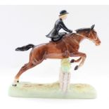 Beswick model of Huntswoman riding side saddle on jumping horse, model no. 982