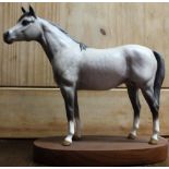 Beswick model of dappled grey Arab stallion in standing position, mounted on wooden plinth, model