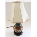 Moorcroft ceramic table lamp on turned wooded base