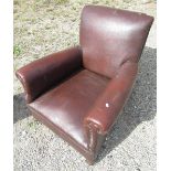 1930's club armchair, upholstered in brown leatherette on squat bun feet with casters, W84cm D82cm