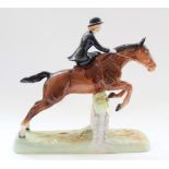 Beswick model of Huntswoman riding side saddle on jumping horse, model no. 982