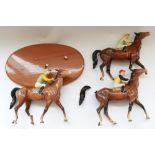 Three Beswick walking racehorses and jockeys, in colourway no.2 on saddlecloth figures, two with