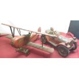 Painted wood aeroplane with pilot and a painted wood car with driver