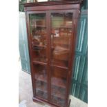 Modern mahogany finish bookcase, with two glazed doors and five adjustable shelves on bracket
