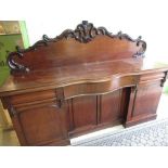 Victorian mahogany inverted breakfront sideboard, with scroll moulded back and four doors, on plinth