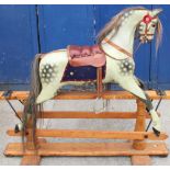 C20th rocking horse in dapple grey coat with brindle plume and tail, leather saddle and stirrups