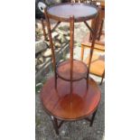 Early C20th mahogany coffee table, circular top on square support joined by stretchers D61cm