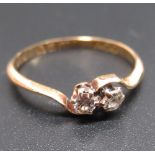 18ct yellow gold diamond crossover ring set with two brilliant cut claw set diamonds, by James