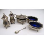 Geo.V hallmarked silver five piece cruet set, including mustard pot and salts with blue glass liners