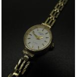 Ladies rotary 9ct gold quartz cocktail watch, signed white dial with applied gold coloured stick