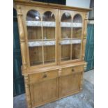 Victorian and later waxed pine dresser, with two glazed doors above two drawers and two panel doors,