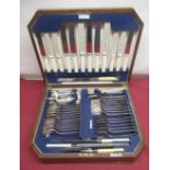 Walker & Hall oak cased canteen of cutlery, knives with white celluloid handles (6 place settings)