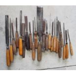 Collection of woodworking chisels of various sizes (23)