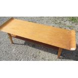 1950's Myers golden oak Long John coffee table, with curved upturned ends and under tier, makers