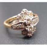 18ct yellow gold diamond ring, two brilliant diamonds with three smaller diamonds claw set top and