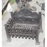 Cast iron fire grate with ornate back depicting a lion rose and thistle, W26cm H44cm