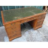 Geo.III style mahogany twin pedestal desk, oin set writing surface and three frieze drawers, on