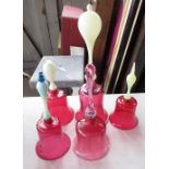 Group of cranberry glass bells with coloured glass handles