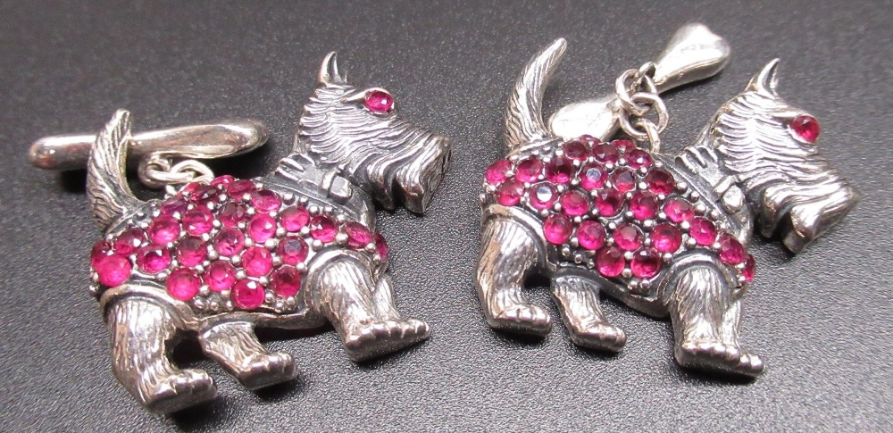 Pair of hallmarked sterling silver cufflinks in the form of Scottie dogs, set with rubies, stamped