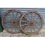 Pair of wooden cart wheels with metal rims, H92cm