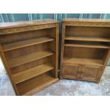 Pair of Jaycee woodwork oak bookcases with lunette carved frieze and adjustable shelves, one with