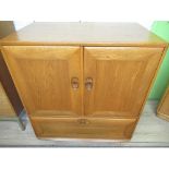 Vintage Blonde Ercol TV cabinet with two doors above a drawer, W85cm D51cm H95cm