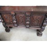 Small Renaissance style oak sideboard, twin panel doors with figural corbels and feet, W130cm