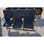 Run of three Kalee cast iron framed Cinema seats with curved backs and lift-up seats, L150cm D43cm