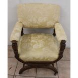 Nick Hancock Collection - Edwardian oak Savonarola type chair, upholstered back, seat and open arms,