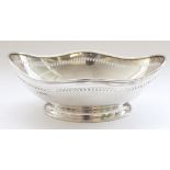 Geo.V hallmarked silver boat shaped table bowl with shaped rim and pierced border on a pedestal