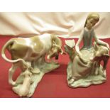 Lladro model of a cow with suckling calf, H16cm and another of a Milkmaid with calf, H22cm (2)