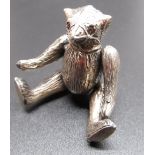 Small continental silver hallmarked articulated Bear pincushion with red glass eyes, stamped .925