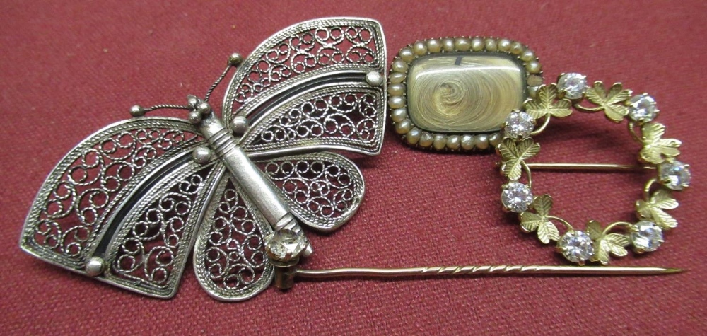 9ct gold hallmarked circular shamrock brooch with 7 paste stones, a single stone tie