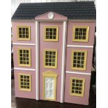 Three story dolls house complete with furnishings and dolls