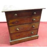 Late Victorian small mahogany chest of four graduating drawers turned handles on platform base
