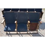 Run of three Kalee cast iron framed Cinema seats with curved backs and lift-up seats, L150cm D43cm