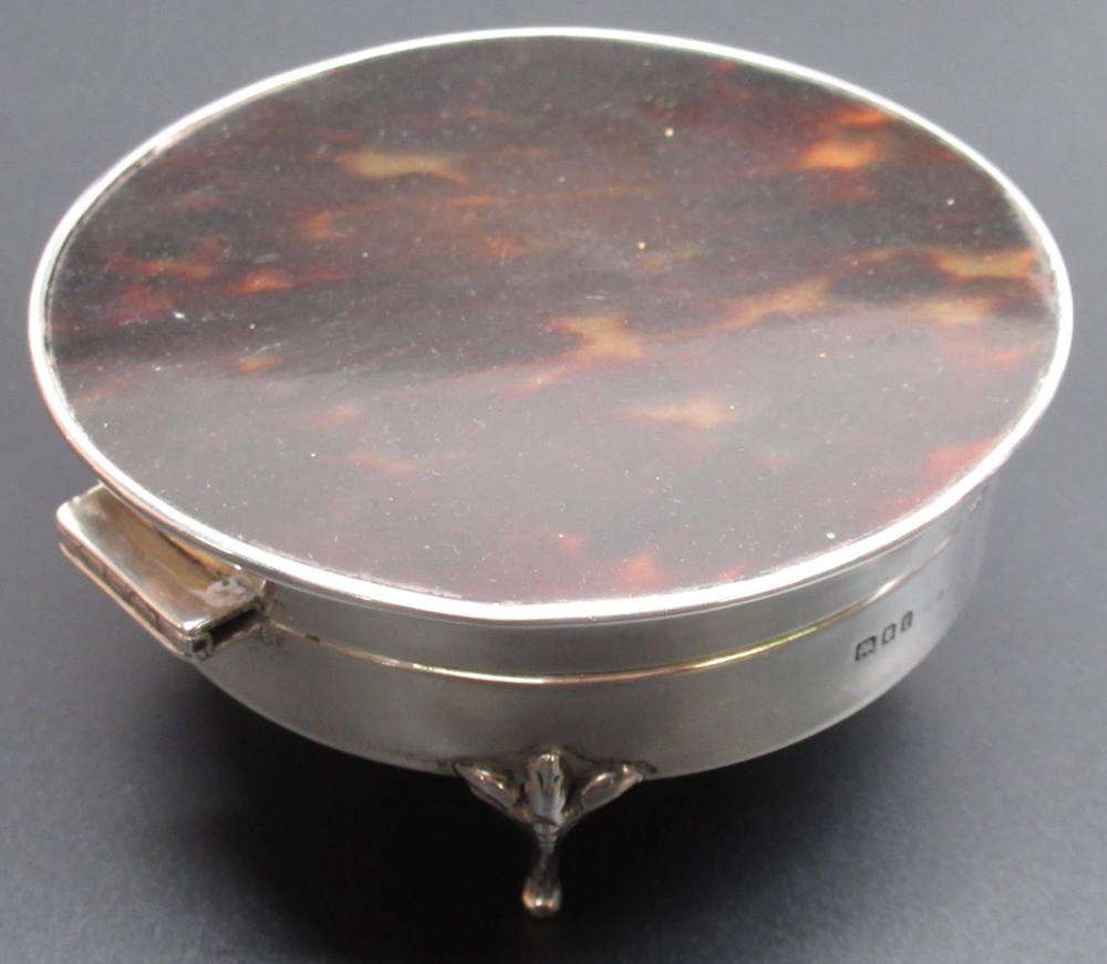 Large Geo.V hallmarked silver circular jewellery box with hinged tortoishell top on four cabriole