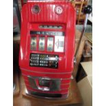 Mills One Armed Bandit 6d fruit machine, red case with chromed and polished metal detail, H66cm