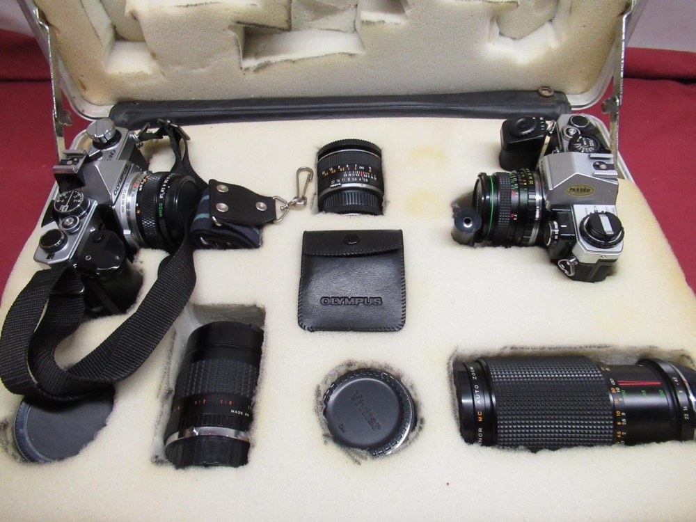 Case containing Olympus OM-2n with Olympus 50mm standard lens and motorwind, Olympus OM10 with
