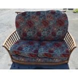 Ercol Renaissance three piece suite and stool, with floral loose back and seat cushions, W128cm