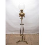 C20th Art Nouveau Barker & Co. Ltd. Kensington brass rise and fall standard lamp on triform base,