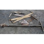 Collection of vintage outdoor tools including crosscut saws, silage knife, peat cutters and yoke