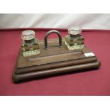 Early C20th Edwardian ink stand with silver plated handle and two large cut glass ink wells W35cm