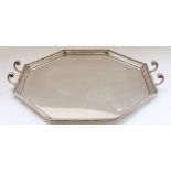 Geo.V hallmarked silver serving tray, of art deco octagonal shape with stepped border and C scroll
